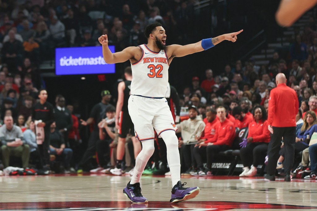 Karl-Anthony Towns reacts after a basket against the Portland Trail Blazers during the first half of an NBA basketball game Sunday, Jan. 11, 2026, in Portland, Ore. 