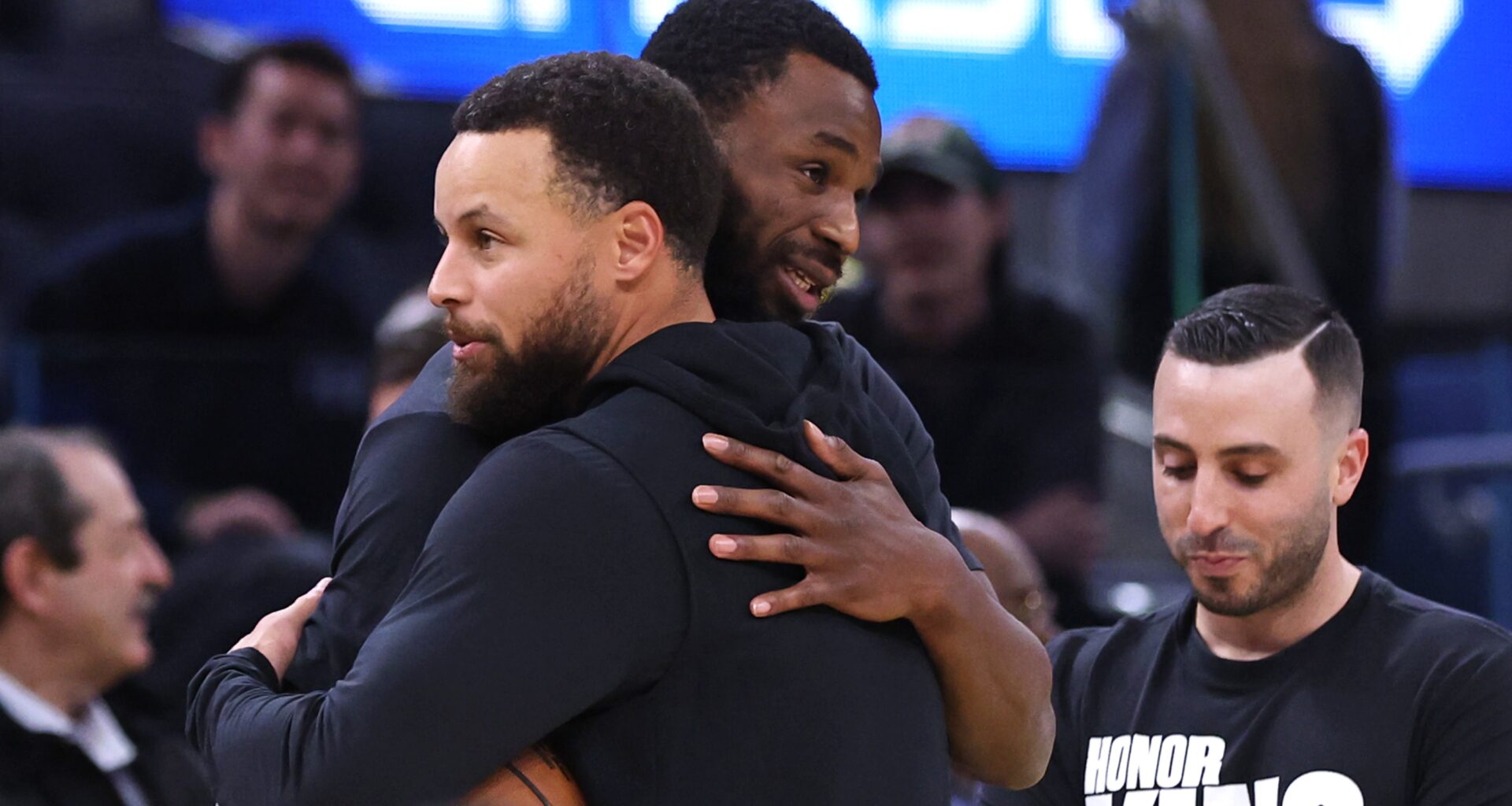 Golden State Warriors' Stephen Curry embraces Miami Heat's Andrew Wiggins before NBA game at Chase Center in San Francisco on Monday, January 19, 2025.