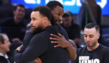 Golden State Warriors' Stephen Curry embraces Miami Heat's Andrew Wiggins before NBA game at Chase Center in San Francisco on Monday, January 19, 2025.