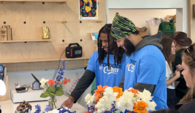Thunder players help build bouquets at Curbside Flowers
