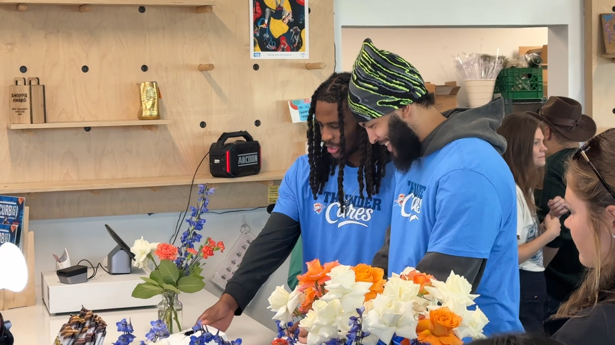 Thunder players help build bouquets at Curbside Flowers