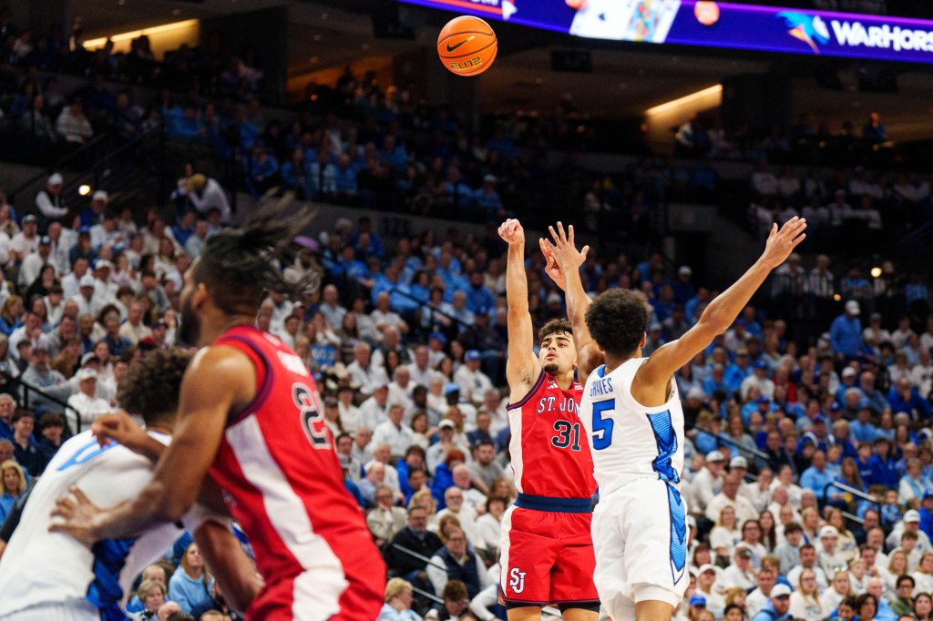 St. John's Red Storm guard Lefteris Liotopoulos (31) shoots the ball against Creighton Bluejays guard Nik Graves (5).