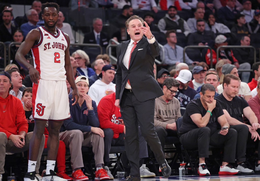 St. John's Red Storm head coach Rick Pitino on the sideline reacting during the first half of a game against the Marquette Golden Eagles.