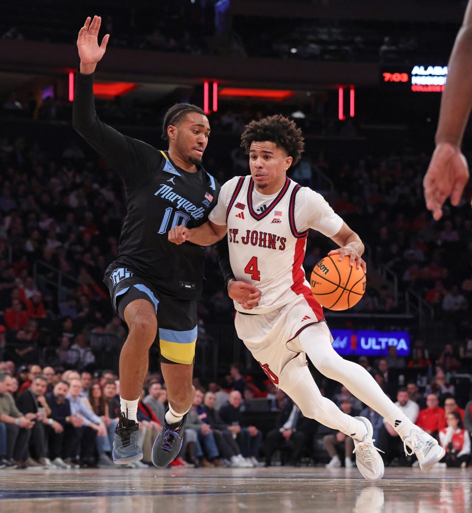 St. John's Red Storm guard Oziyah Sellers (4) drives to the basket as Marquette Golden Eagles guard Adrien Stevens (10) defends.