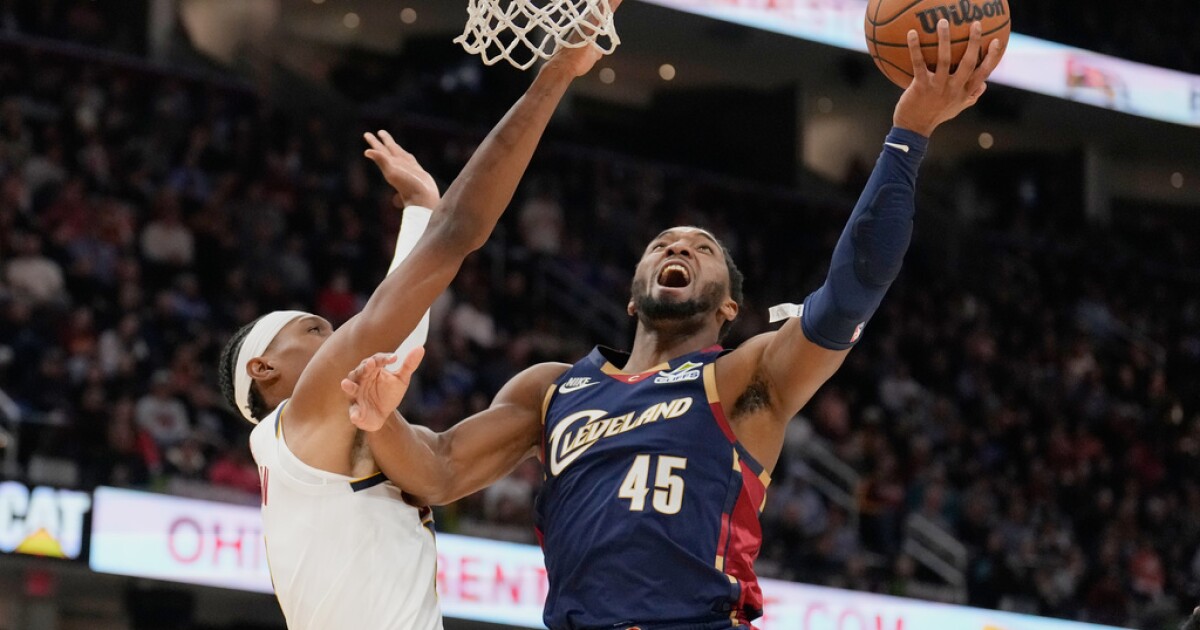 Donovan Mitchell scores 33 points, Cavs outlast short-handed Nuggets 113-108