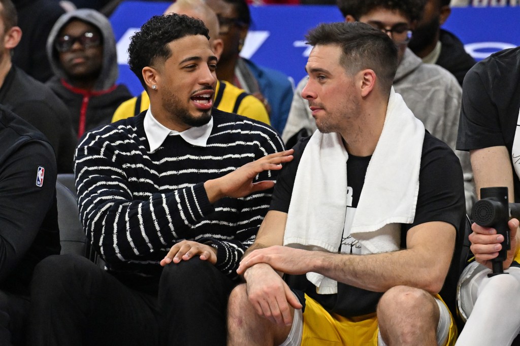 Indiana Pacers guards Tyrese Haliburton and T.J. McConnell on the bench.
