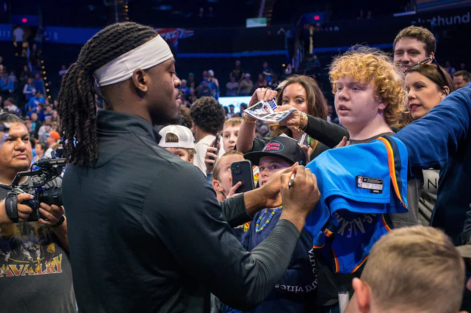 OKLAHOMA CITY, OKLAHOMA - FEBRUARY 12: Jalen Williams #8 of the Oklahoma City Thunder signs autographs prior to the game against the Milwaukee Bucks at Paycom Center on February 12, 2026 in Oklahoma City, Oklahoma. NOTE TO USER: User expressly acknowledges and agrees that, by downloading and or using this photograph, User is consenting to the terms and conditions of the Getty Images License Agreement. (Photo by William Purnell/Getty Images)