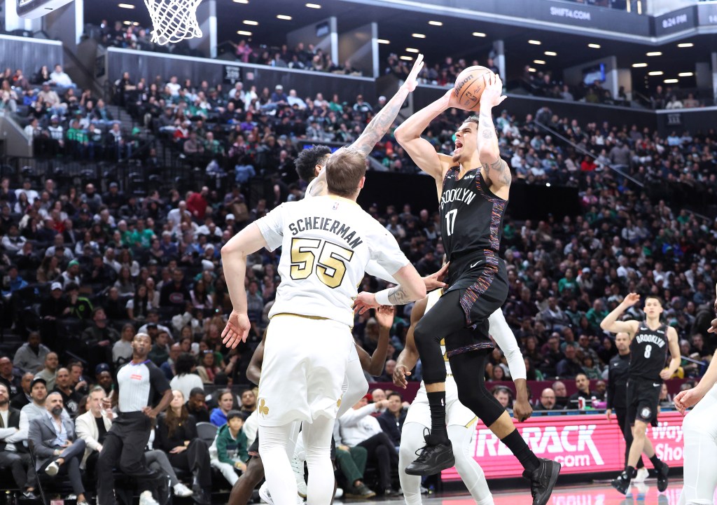 Michael Porter Jr. of the Brooklyn Nets shoots the ball in a basketball game against the Boston Celtics.