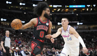 Apr 9, 2025; Chicago, Illinois, USA; Miami Heat guard Tyler Herro (14) defends Chicago Bulls guard Coby White (0) during the first quarter at United Center. Mandatory Credit: David Banks-Imagn Images