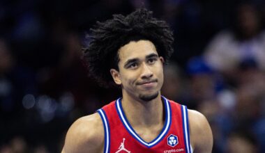 Nov 22, 2024; Philadelphia, Pennsylvania, USA; Philadelphia 76ers guard Jared McCain (20) reacts to his three pointer against the Brooklyn Nets during the first quarter at Wells Fargo Center. Mandatory Credit: Bill Streicher-Imagn Images