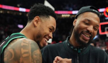Dec 28, 2025; Portland, Oregon, USA; Boston Celtics guard Anfernee Simons (4) and Portland Trail Blazers guard Damian Lillard (0) meet after the game at Moda Center. Mandatory Credit: Soobum Im-Imagn Images
