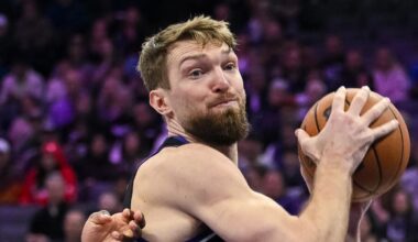 Feb 4, 2026; Sacramento, California, USA; Sacramento Kings forward/center Domantas Sabonis (11) rebounds tagainst Memphis Grizzlies guard Cedric Coward (23) during the third quarter at Golden 1 Center. Mandatory Credit: Ed Szczepanski-Imagn Images