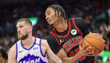 Nov 16, 2025; Salt Lake City, Utah, USA; Chicago Bulls forward Julian Phillips (15) makes a rebound against Utah Jazz guard/forward Svi Mykhailiuk (10) during the first half at Delta Center. Mandatory Credit: Peter Creveling-Imagn Images