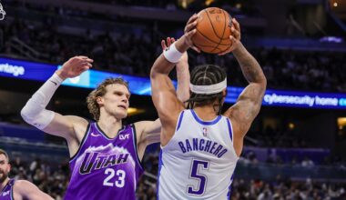 Feb 7, 2026; Orlando, Florida, USA; Utah Jazz forward Lauri Markkanen (23) defends Orlando Magic forward Paolo Banchero (5) during the second quarter at Kia Center. Mandatory Credit: Mike Watters-Imagn Images