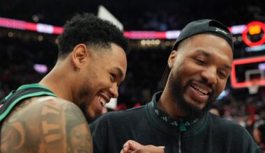Dec 28, 2025; Portland, Oregon, USA; Boston Celtics guard Anfernee Simons (4) and Portland Trail Blazers guard Damian Lillard (0) meet after the game at Moda Center. Mandatory Credit: Soobum Im-Imagn Images