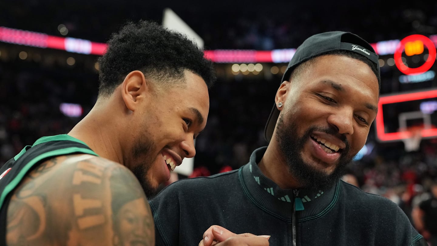 Dec 28, 2025; Portland, Oregon, USA; Boston Celtics guard Anfernee Simons (4) and Portland Trail Blazers guard Damian Lillard (0) meet after the game at Moda Center. Mandatory Credit: Soobum Im-Imagn Images