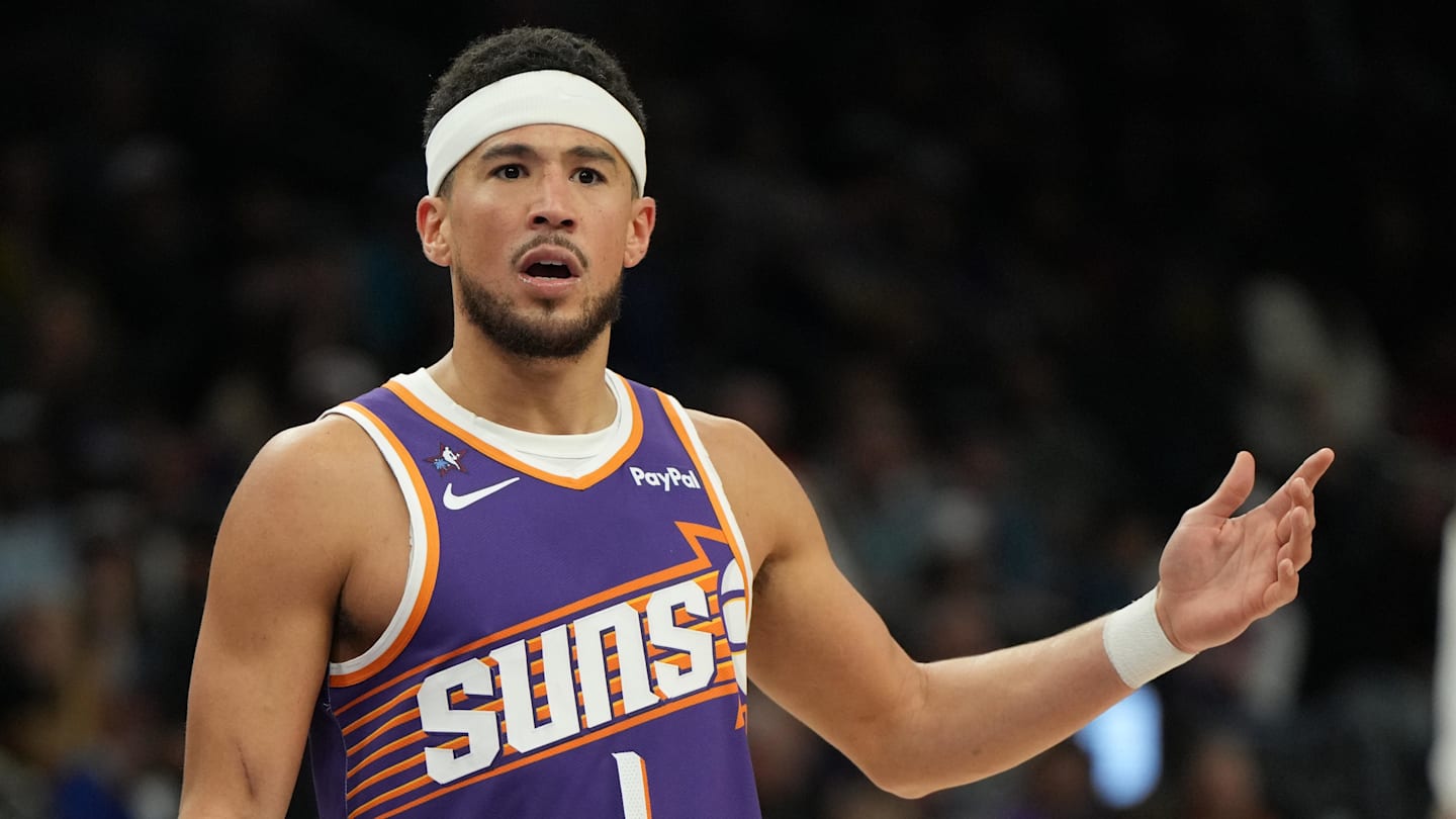 Phoenix Suns guard Devin Booker (1) reacts after a foul call against the Philadelphia 76ers during the second half of an NBA game at Mortgage Matchup Center.