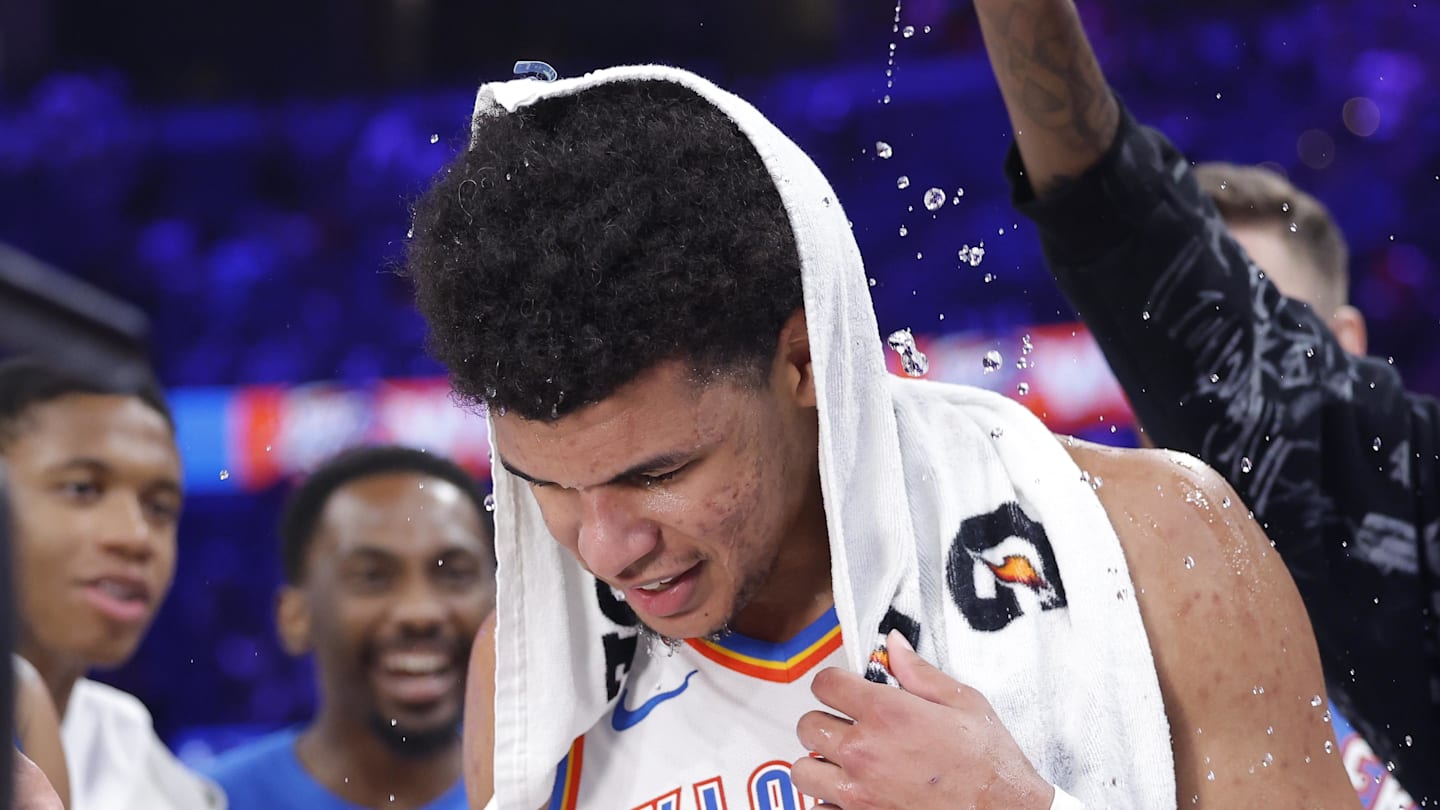 Oklahoma City Thunder forward Ousmane Dieng (13) has water poured on him by his teammates after making the game winning shot against the Denver Nuggets during the second half at Paycom Center on October 17, 2025.