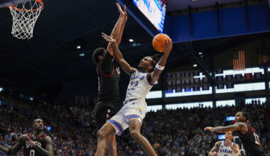 Feb 7, 2026; Lawrence, Kansas, USA; Kansas Jayhawks guard Darryn Peterson (22) shoots against Utah Utes forward Josh Hayes (7) during the second half at Allen Fieldhouse. Mandatory Credit: Jay Biggerstaff-Imagn Images