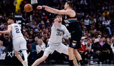 Feb 11, 2026; Denver, Colorado, USA; Denver Nuggets center Nikola Jokic (15) passes the ball as Memphis Grizzlies center Lawson Lovering (34) defends in the fourth quarter at Ball Arena. Mandatory Credit: Isaiah J. Downing-Imagn Images
