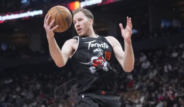 Dec 7, 2025; Toronto, Ontario, CAN; Toronto Raptors center Jakob Poeltl (19) gets control of a rebound against the Boston Celtics during the first half at Scotiabank Arena. Mandatory Credit: John E. Sokolowski-Imagn Images
