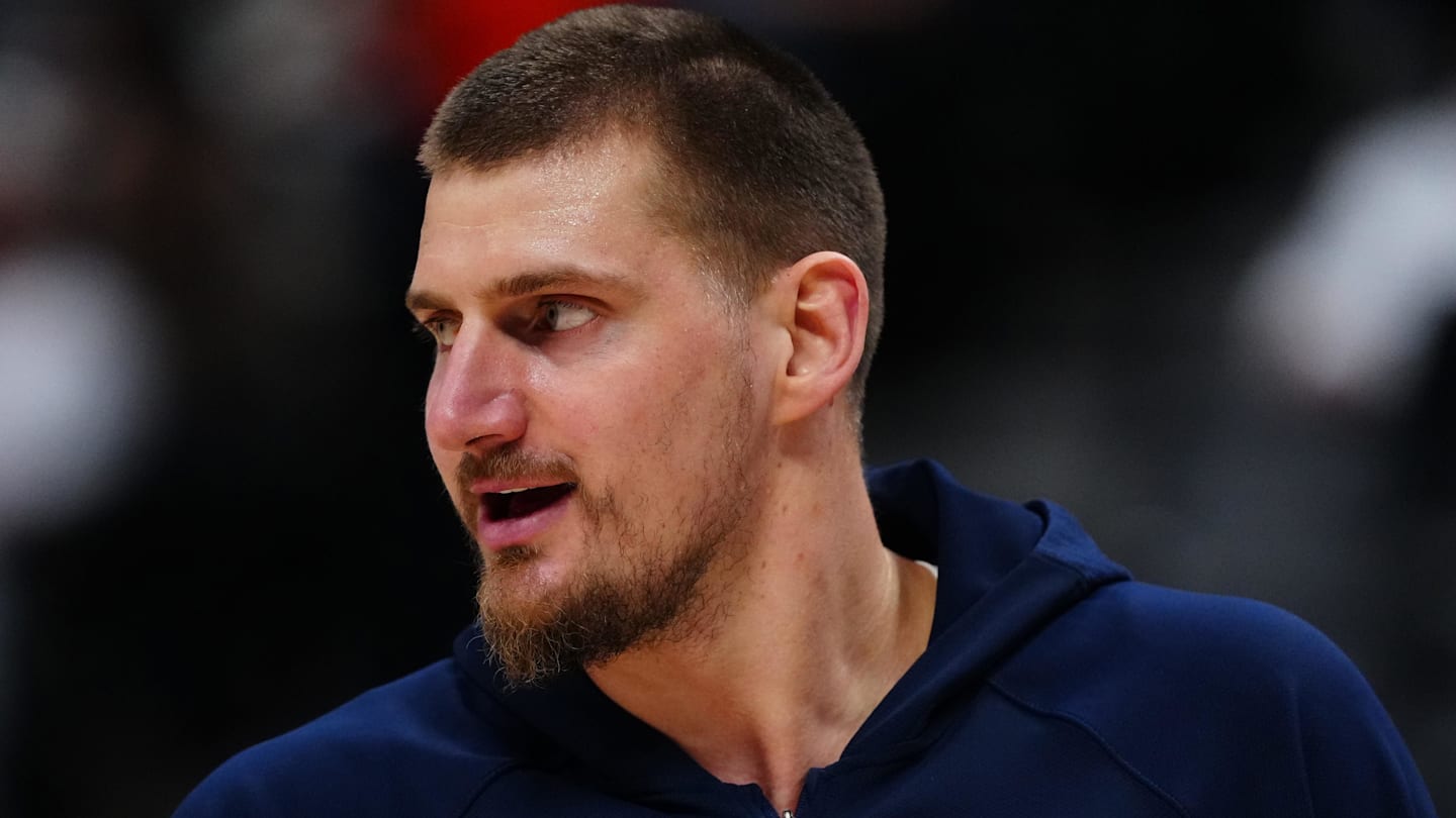 Dec 18, 2025; Denver, Colorado, USA;  Denver Nuggets center Nikola Jokic (15) reacts before the game against the Orlando Magic at Ball Arena. Mandatory Credit: Ron Chenoy-Imagn Images