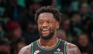 Feb 9, 2026; Minneapolis, Minnesota, USA; Minnesota Timberwolves forward Julius Randle (30) and guard Anthony Edwards (5) laugh after a timeout against the Atlanta Hawks in the fourth quarter at Target Center. Mandatory Credit: Brad Rempel-Imagn Images