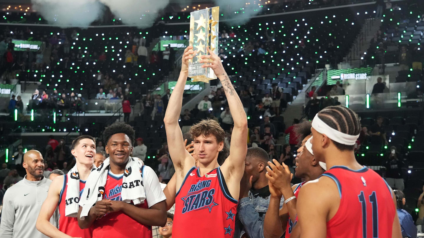 Feb 13, 2026; Inglewood, California, USA; Team Vince frontcourt Matas Buzelis (14) of the Chicago Bulls celebrates with the trophy after defeating Team Melo during an NBA All Star Rising Stars championship game at Intuit Dome. Mandatory Credit: Kirby Lee-Imagn Images