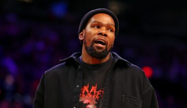 Nov 20, 2024; Phoenix, Arizona, USA; Phoenix Suns forward Kevin Durant looks on from the sidelines during the game between the Phoenix Suns and the New York Knicks at Footprint Center. Mandatory Credit: Mark J. Rebilas-Imagn Images
