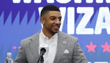 Jan 9, 2026; Washington, District of Columbia, USA; Washington Wizards general manager Will Dawkins (L) introduces newly acquired Wizards guard Trae Young (R) at a press conference prior to the Wizards' game against the New Orleans Pelicans at Capital One Arena. Mandatory Credit: Geoff Burke-Imagn Images