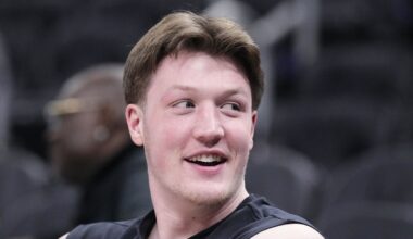 Jan 2, 2026; Milwaukee, Wisconsin, USA; Charlotte Hornets guard Kon Knueppel (7) watching his teammates warm up before a game against the Milwaukee Bucks at Fiserv Forum. Mandatory Credit: Michael McLoone-Imagn Images