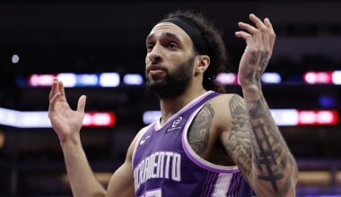 Feb 19, 2026; Sacramento, California, USA; Sacramento Kings guard Devin Carter (22) gestures to the Orlando Magic bench to acknowledge the foul he committed during the third quarter at Golden 1 Center. Mandatory Credit: Kelley L Cox-Imagn Images