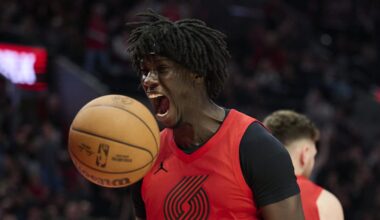 Jan 9, 2026; Portland, Oregon, USA; Portland Trail Blazers guard Sidy Cissoko (91) reacts after slam dunking the basketball during the second half against Houston Rockets center Steven Adams (12) at Moda Center. Mandatory Credit: Troy Wayrynen-Imagn Images