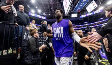 Utah Jazz forward Jaren Jackson Jr. slaps hands with fans...