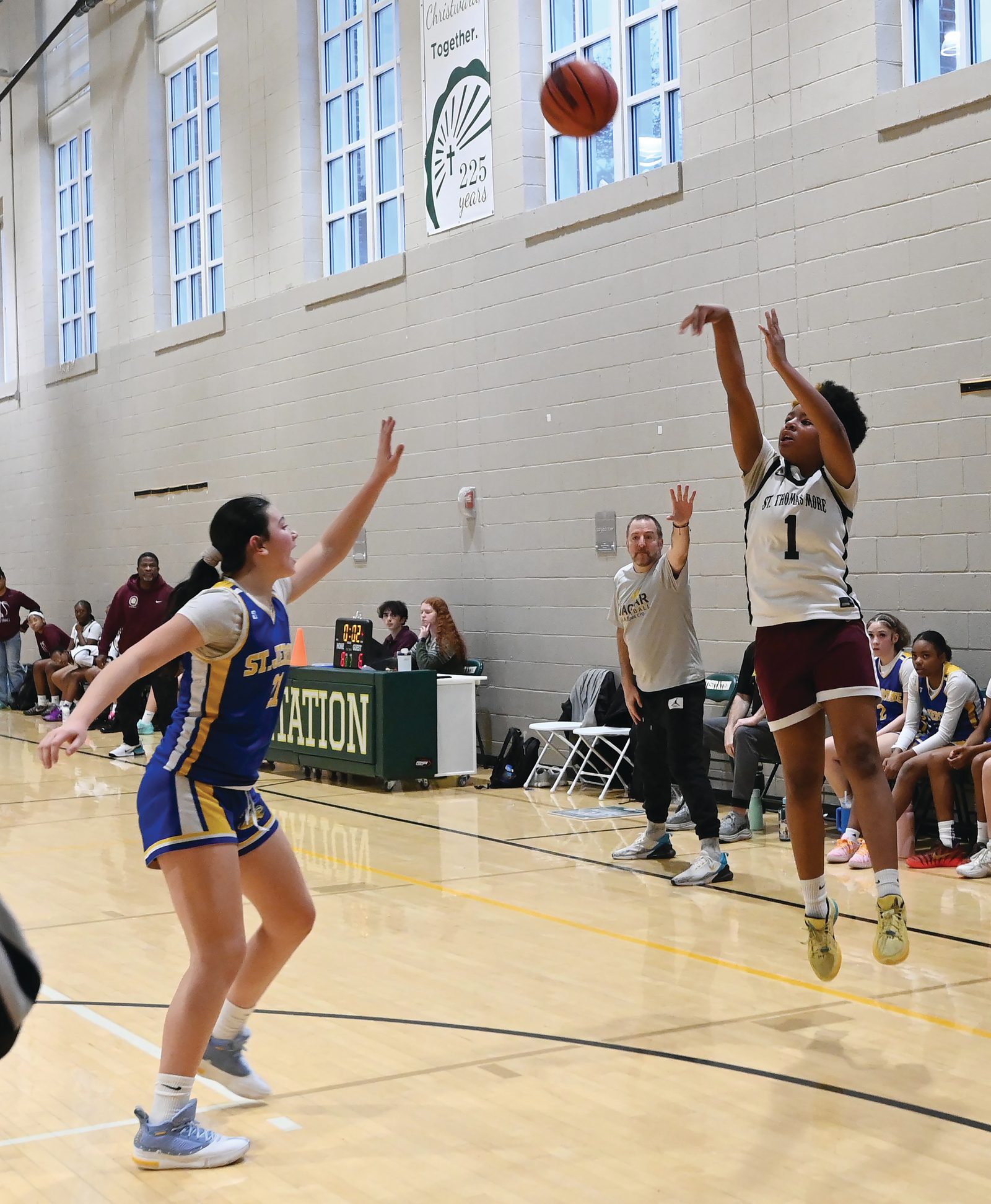Ashley Hose  (#23) from St. Thomas More takes a shot while being defended by Mullyrana Durce (#33) of St. Jerome’s during the CYO girls’ 14U basketball championship game on Feb. 15 at Georgetown Visitation that was won by St. Thomas More, 34-26. (Catholic Standard photo by Patrick Ryan)