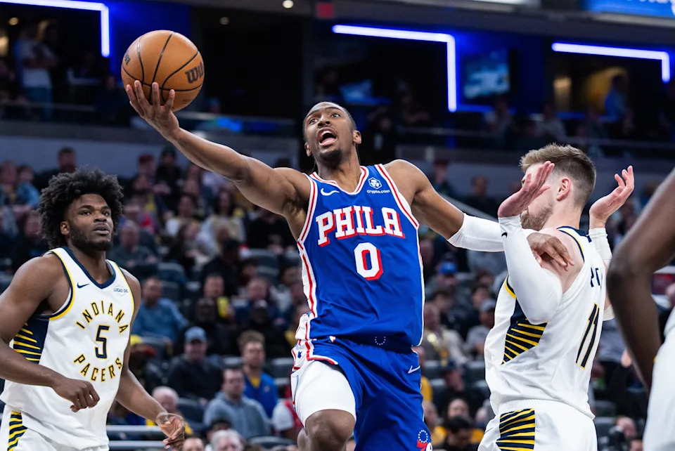 Feb 24, 2026; Indianapolis, Indiana, USA; Philadelphia 76ers guard Tyrese Maxey (0) shoots the ball while Indiana Pacers center Micah Potter (11) defends in the second half at Gainbridge Fieldhouse. Mandatory Credit: Trevor Ruszkowski-Imagn Images