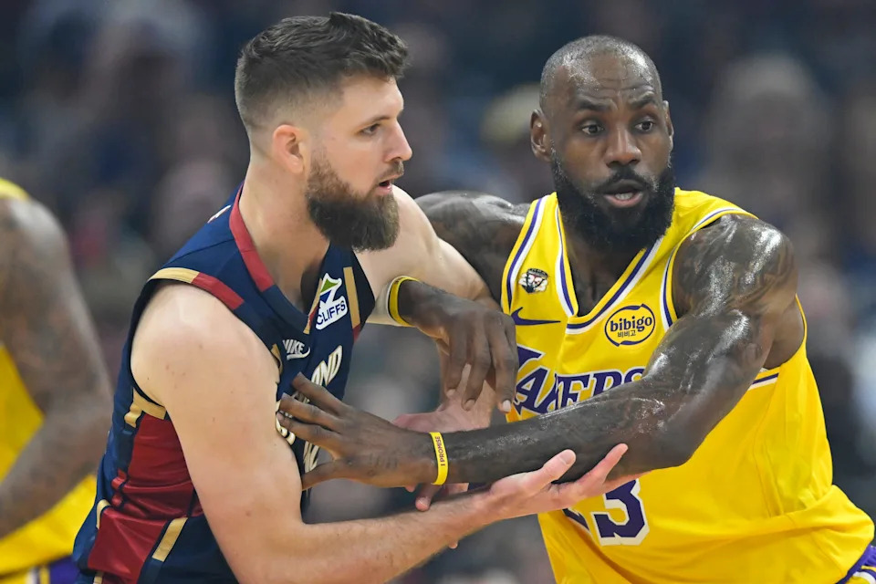 Jan 28, 2026; Cleveland, Ohio, USA; Cleveland Cavaliers forward Dean Wade (32) tries to get past Los Angeles Lakers forward LeBron James (23) in the first quarter at Rocket Arena. Mandatory Credit: David Richard-Imagn Images