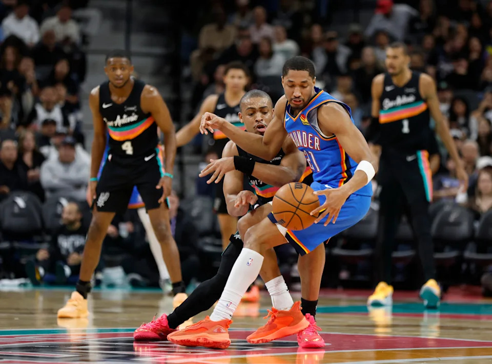 SAN ANTONIO, TX - FEBRUARY 4: Keldon Johnson #3 of the San Antonio Spurs looks to make a steal on Aaron Wiggins 321 of the Oklahoma City Thunder in the second half at Frost Bank Center on February 1, 2026 in San Antonio, Texas. NOTE TO USER: User expressly acknowledges and agrees that, by downloading and or using this photograph, User is consenting to terms and conditions of the Getty Images License Agreement. (Photo by Ronald Cortes/Getty Images)