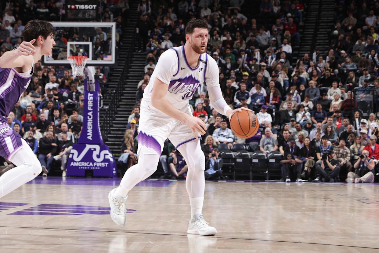 Jusuf Nurkic dribbling the ball during a game between the Utah Jazz and the Sacramento Kings.