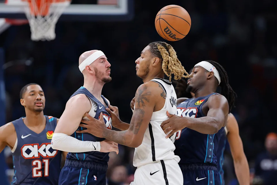Feb 20, 2026; Oklahoma City, Oklahoma, USA; Oklahoma City Thunder guard Alex Caruso (9) and Brooklyn Nets forward/center Noah Clowney (21) get into an argument during the second half at Paycom Center. Mandatory Credit: Alonzo Adams-Imagn Images