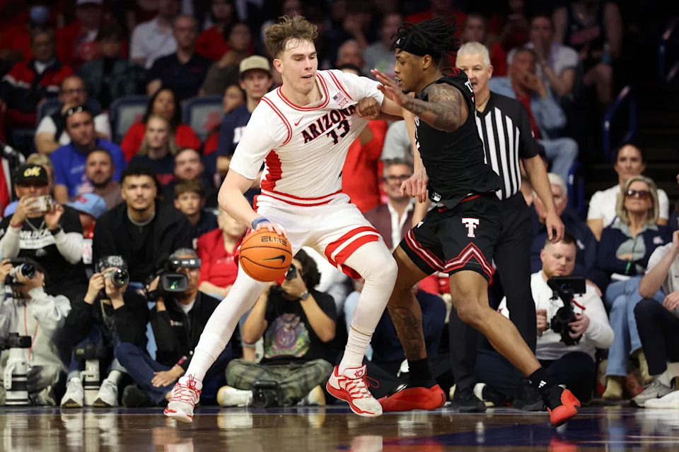 TUCSON, ARIZONA – FEBRUARY 14: Motiejus Krivas #13 of the Arizona Wildcats posts up on JT Toppin #15 of the Texas Tech Red Raiders during the second half at McKale Center at ALKEME Arena on February 14, 2026 in Tucson, Arizona. (Photo by Chris Coduto/Getty Images) | Getty Images