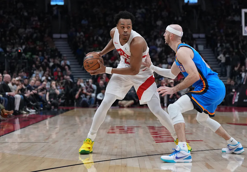 Feb 24, 2026; Toronto, Ontario, CAN; Toronto Raptors forward Scottie Barnes (4) controls the ball against Oklahoma City Thunder guard Alex Caruso (9) during the first quarter at Scotiabank Arena. Mandatory Credit: Nick Turchiaro-Imagn Images