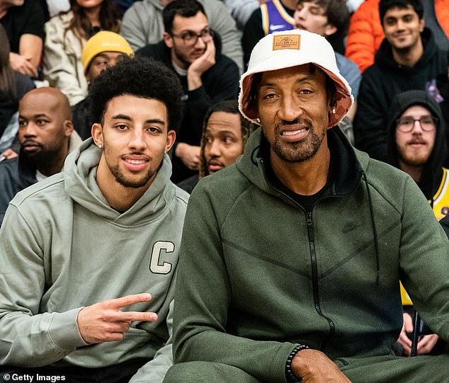 Scotty Pippen Jr. is pictured alongside his father, Scottie Pippen, at a 2022 high school game