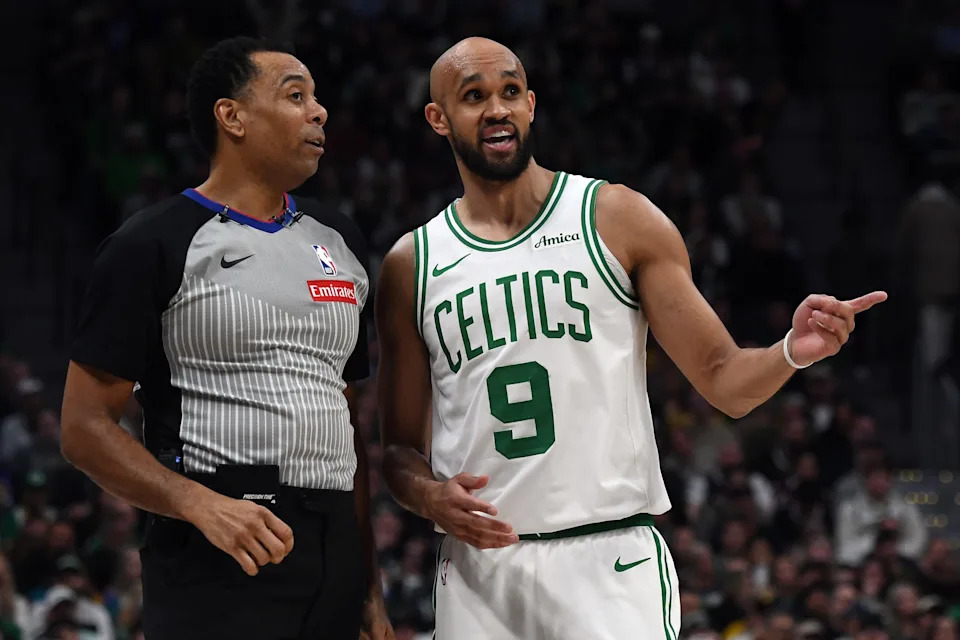 Feb 25, 2026; Denver, Colorado, USA; Boston Celtics guard Derrick White (9) talks with a referee during the second half against the Denver Nuggets at Ball Arena. Mandatory Credit: Christopher Hanewinckel-Imagn Images