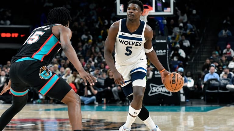 Minnesota Timberwolves guard Anthony Edwards (5) handles the ball against...