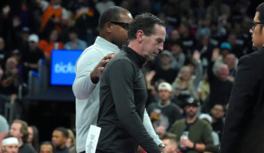 Cleveland Cavaliers head coach Kenny Atkinson is escorted off the court after being ejected for getting his second technical foul during the second half of an NBA basketball game against the Phoenix Suns Friday, Jan. 30, 2026, in Phoenix. (AP Photo/Ross D. Franklin)