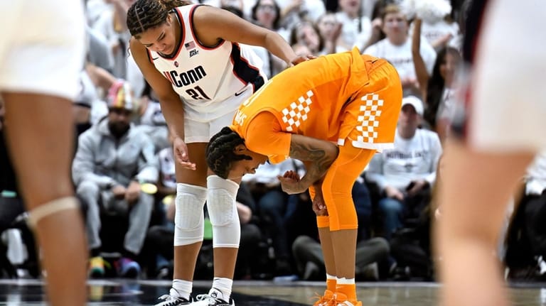 UConn forward Sarah Strong (21) checks on Tennessee forward Zee...