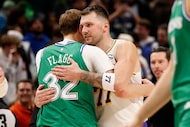 Dallas Mavericks forward Cooper Flagg (32) receives a hug from Los Angeles Lakers guard Luka...