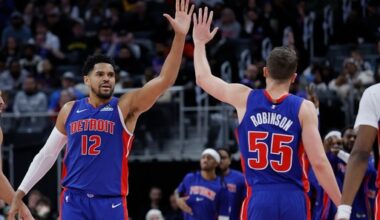 Detroit Pistons forward Tobias Harris (12) celebrates with forward Duncan Robinson (55) during the second half of an NBA basketball game against the Sacramento Kings, Sunday, Jan. 25, 2026, in Detroit. (AP Photo/Duane Burleson)