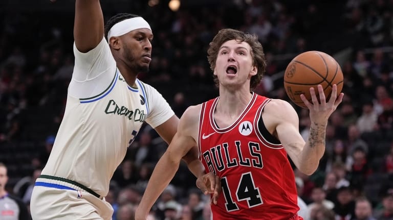 Chicago Bulls' Matas Buzelis gets past Milwaukee Bucks' Myles Turner...